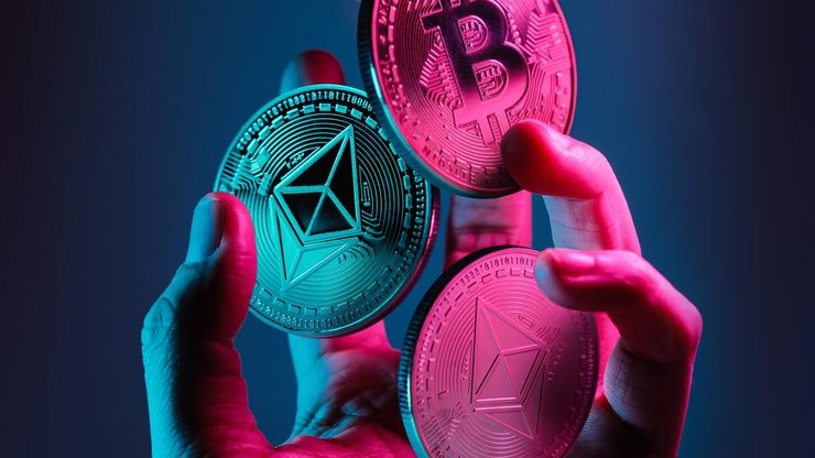 Ethereum,And,Bitcoin,Tokens,Floating,Over,A,Hand,With,Blue