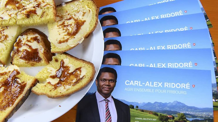 La Cuchaule (brioche) protégée par une AOP dans l'UE également (photo d'archives, avec de la Cuchaule sur un flyer du candidat fribourgeois Carl-Alex Ridoré lors de l'élection complémentaire au Conseil des Etats en septembre 2021).