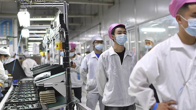 Confinements et dépistages obligatoires pèsent sur la productivité de l'usine du monde. (archive)